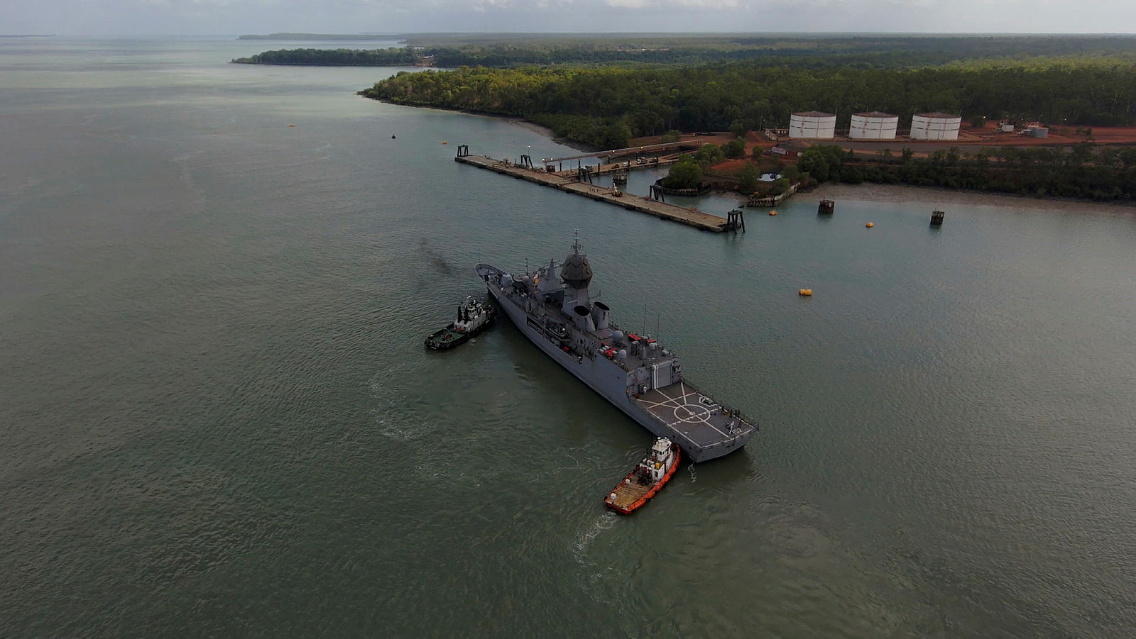 Royal Australian Navy vessel operating near shore.